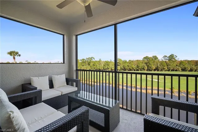 a kitchen with sink refrigerator and couch