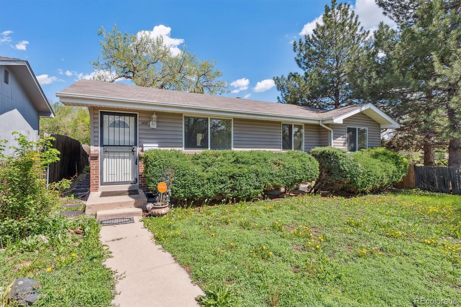 200 Perry Street Denver, CO 80219 - Photo 1 of 24 a front view of a house with a yard