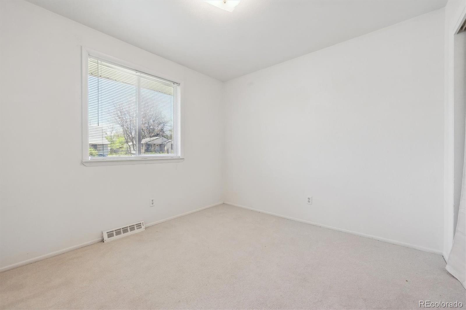 200 Perry Street Denver, CO 80219 - Photo 17 of 24 an empty room with a window