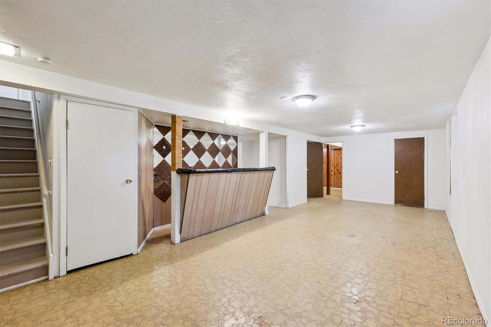 200 Perry Street Denver, CO 80219 - Photo 20 of 24 a view of a room with an empty room