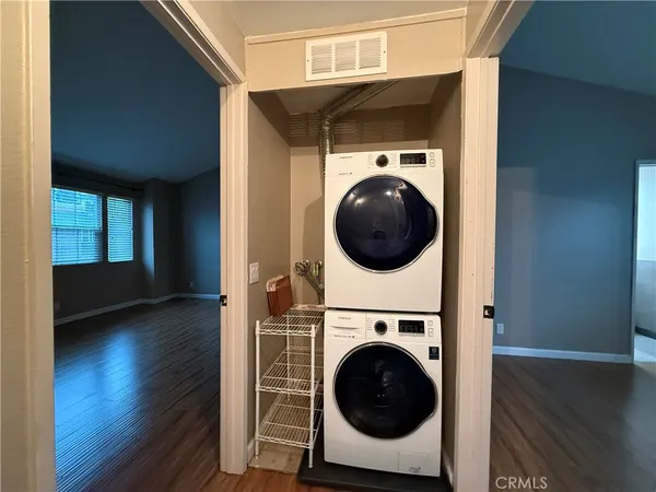 a view of a hallway with washer and dryer