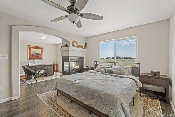 a bedroom with a bed and a fireplace