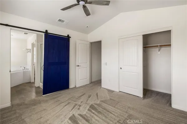 a spacious bathroom with a double vanity sink mirror and shower