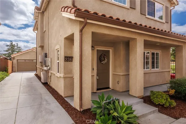 a front view of a house with a garage