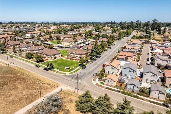 an aerial view of residential houses with outdoor space