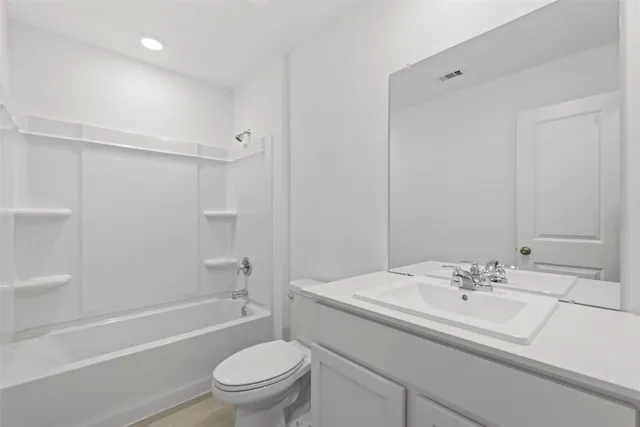 a bathroom with a sink a toilet and a bathtub