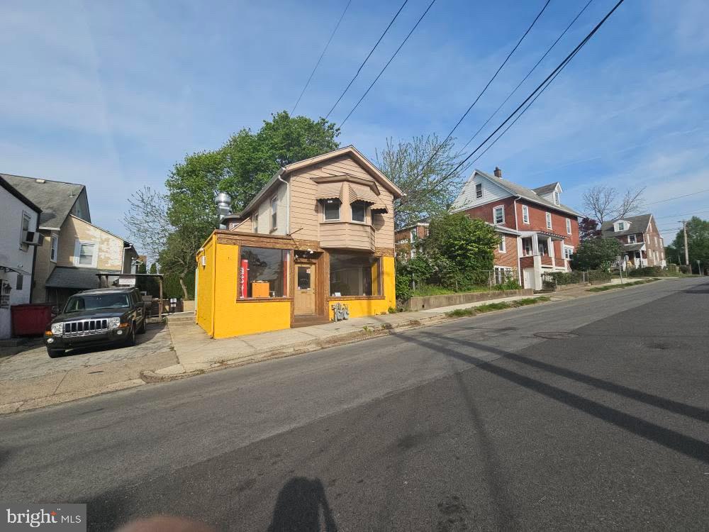 107 East County Line Road, Unit 2 Ardmore, PA 19003 - Photo 1 of 17 a front view of a house with a yard