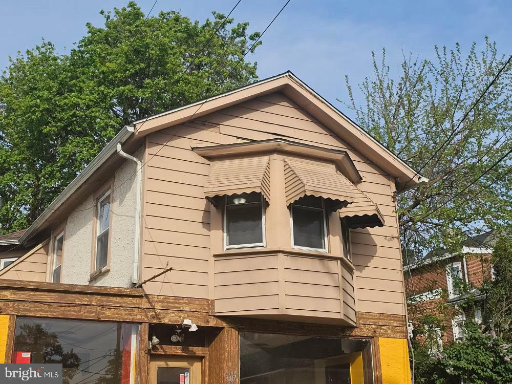 107 East County Line Road, Unit 2 Ardmore, PA 19003 - Photo 14 of 17 a view of a house with a small yard