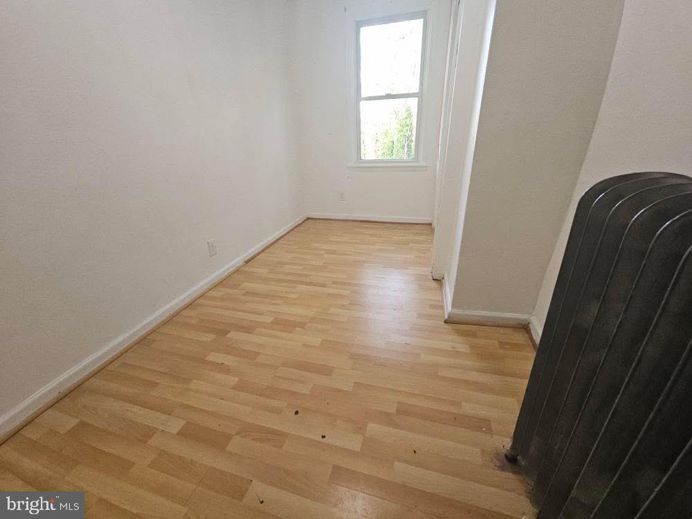 107 East County Line Road, Unit 2 Ardmore, PA 19003 - Photo 8 of 17 a view of a small space with wooden floor and a window