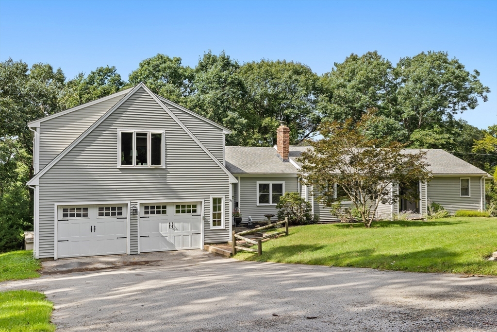 91 Canoe Tree Way Marshfield, MA 02050 - Photo 1 of 35 a front view of a house with a yard