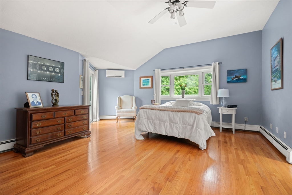 91 Canoe Tree Way Marshfield, MA 02050 - Photo 13 of 35 a bedroom with a bed and a dresser