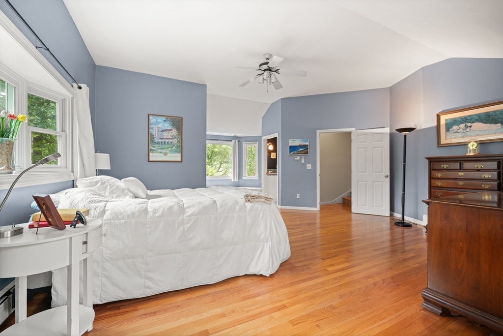 91 Canoe Tree Way Marshfield, MA 02050 - Photo 15 of 35 a spacious bedroom with a bed and wooden floor
