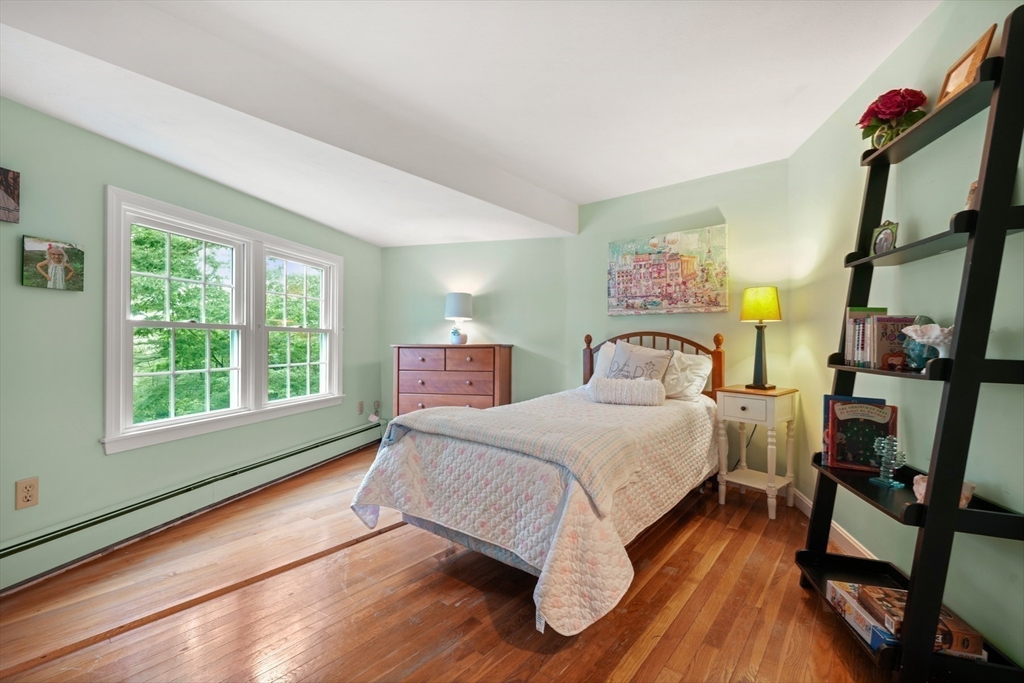 91 Canoe Tree Way Marshfield, MA 02050 - Photo 16 of 35 a bedroom with a bed and a large window