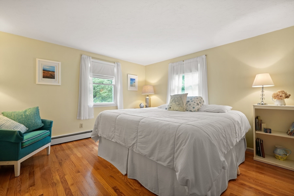 91 Canoe Tree Way Marshfield, MA 02050 - Photo 17 of 35 a spacious bedroom with a bed and window