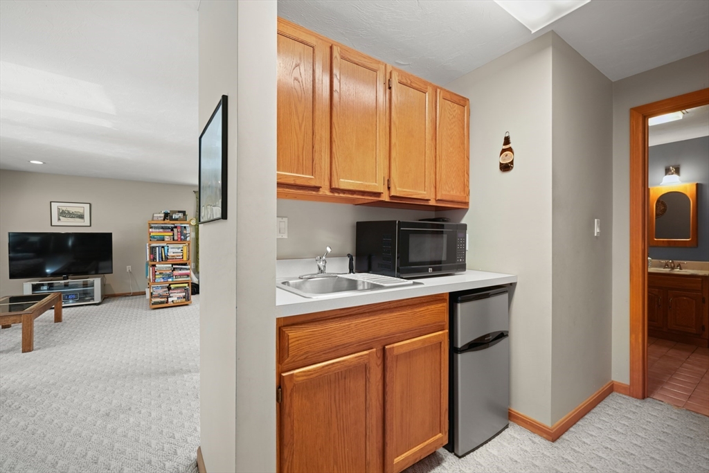 91 Canoe Tree Way Marshfield, MA 02050 - Photo 21 of 35 a view of kitchen with kitchen island sink stove and refrigerator