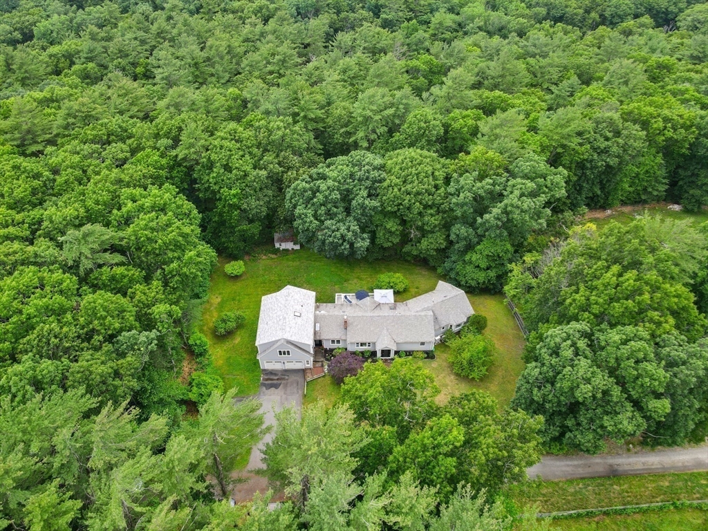 91 Canoe Tree Way Marshfield, MA 02050 - Photo 29 of 35 a view of a table and chairs in the green field