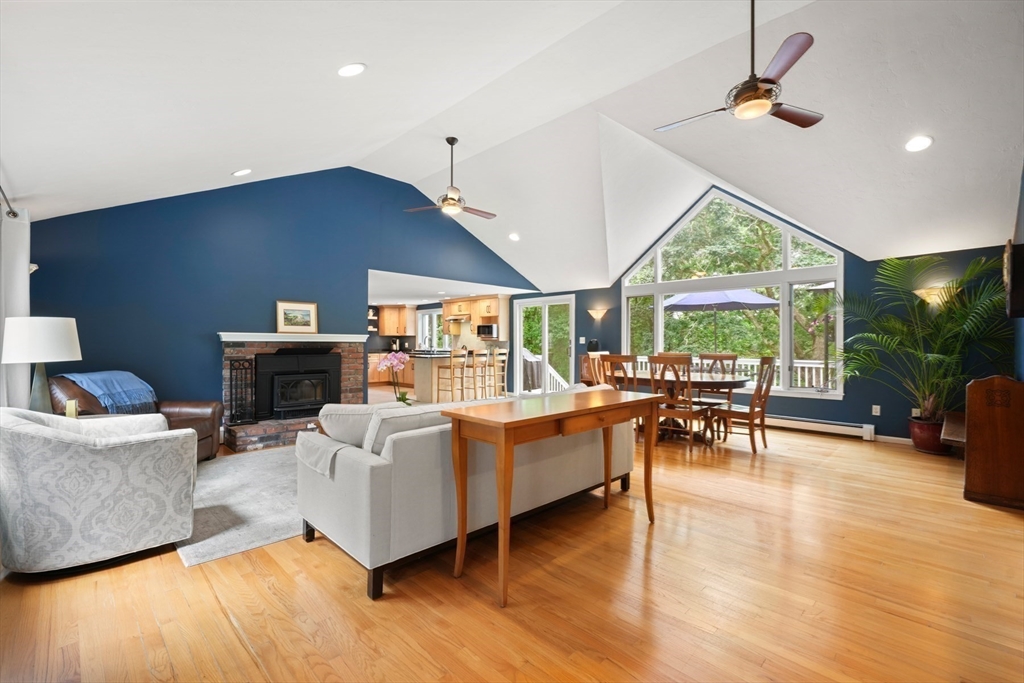 91 Canoe Tree Way Marshfield, MA 02050 - Photo 4 of 35 a living room with fireplace furniture and a large window