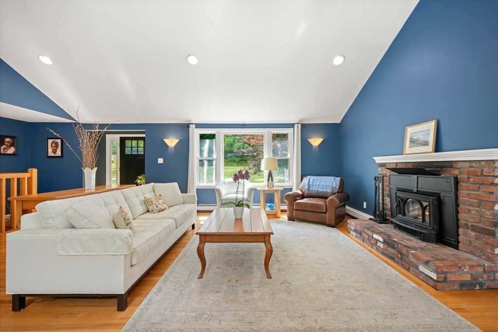 91 Canoe Tree Way Marshfield, MA 02050 - Photo 5 of 35 a living room with furniture and a fireplace