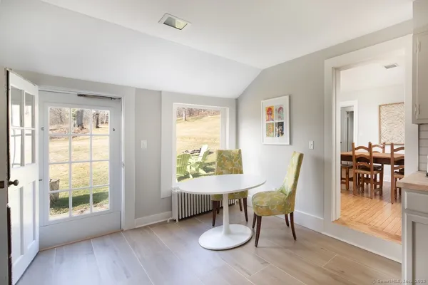 a view of a dining room with furniture window and outside view