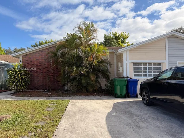 a view of a car in front of a house