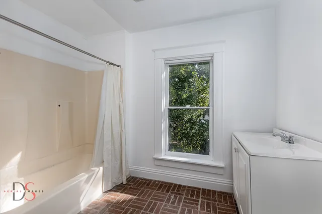 a view of an entryway with wooden floor and stairs