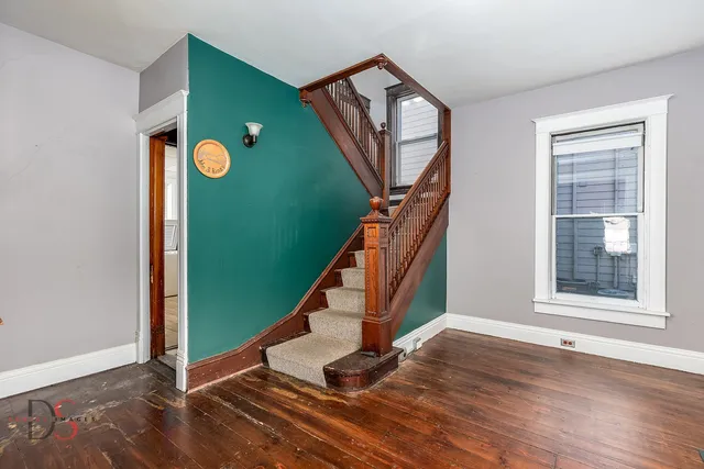 a kitchen with a refrigerator and a sink