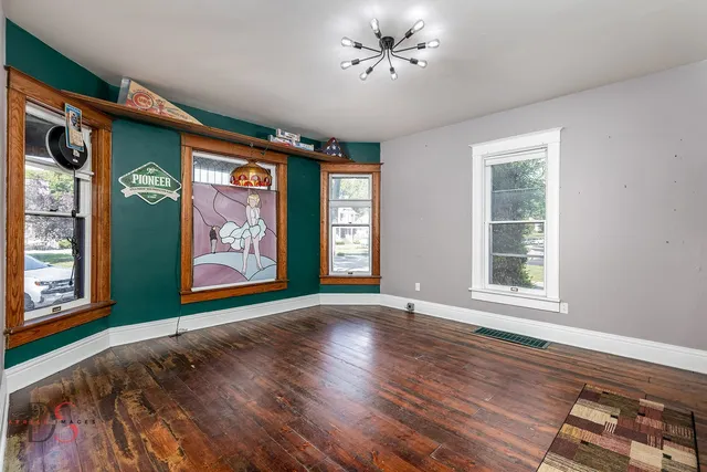 a room with wooden floors and equipment