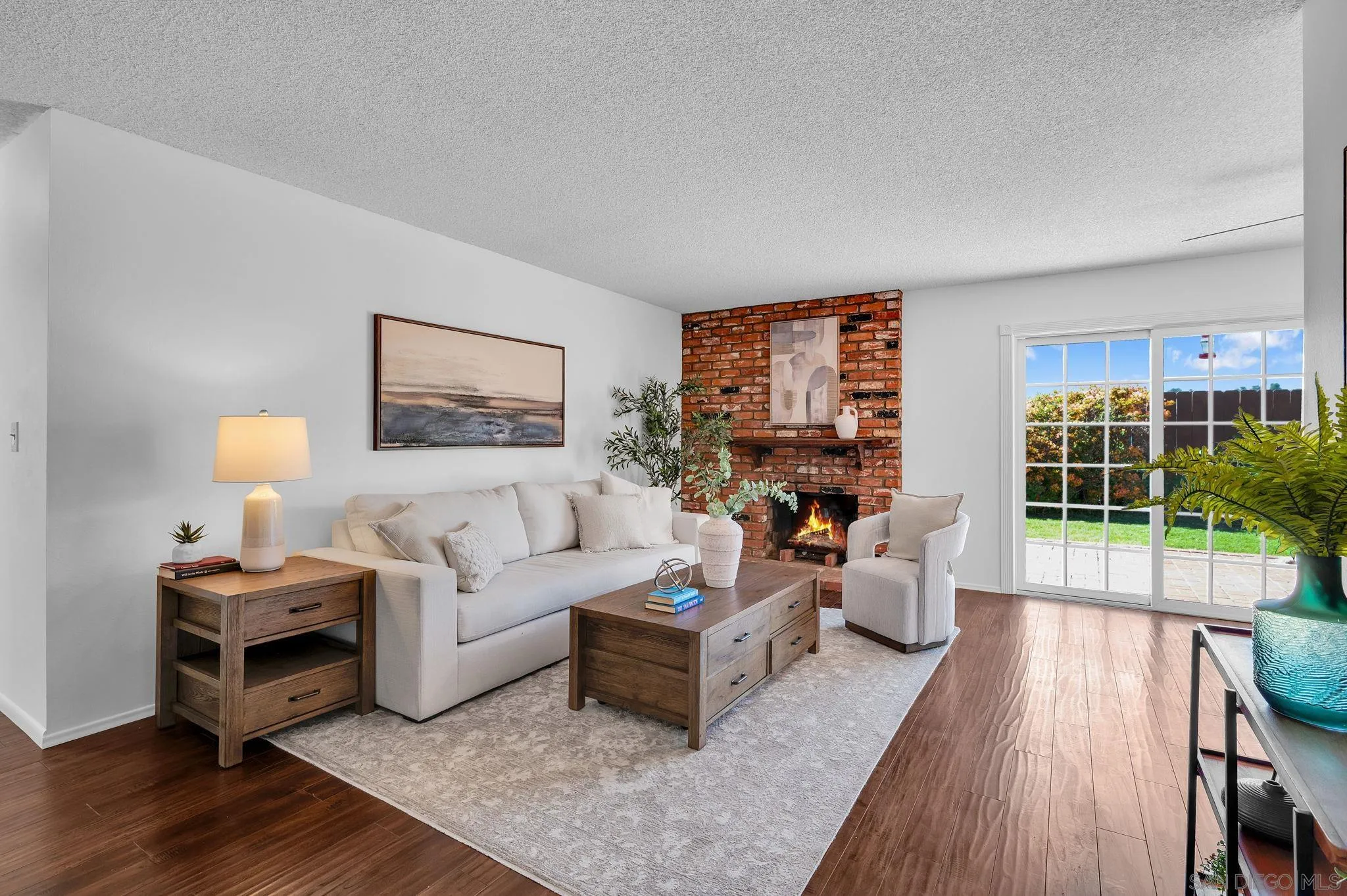 10834 Buggywhip Drive Spring Valley, CA 91978 - Photo 2 of 36 a living room with furniture a lamp wooden floor and a potted plant