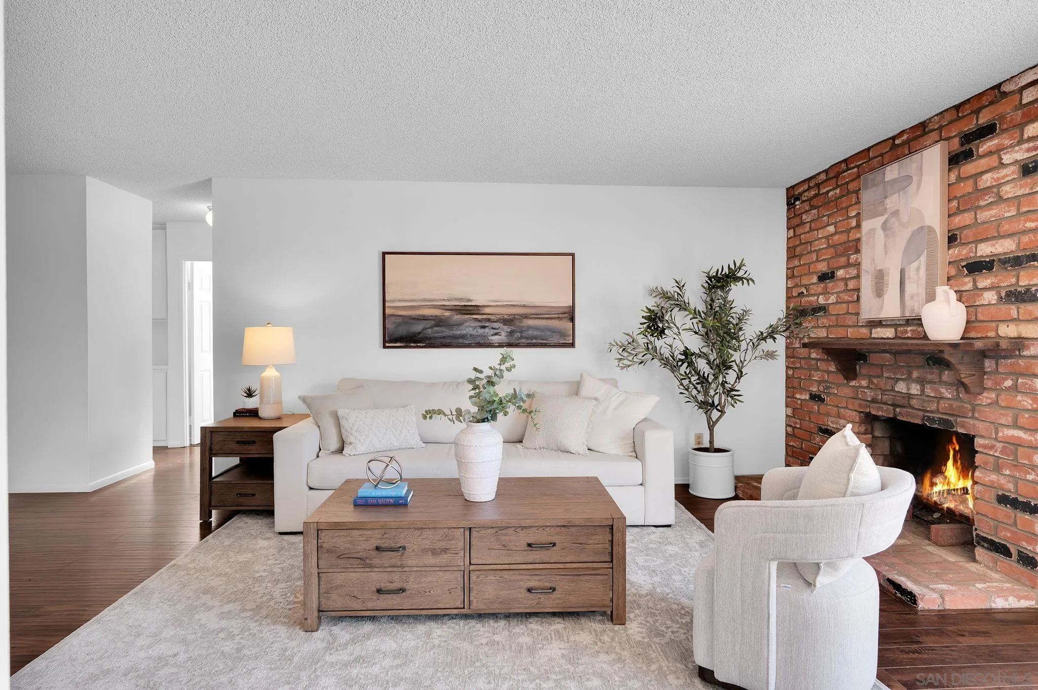 10834 Buggywhip Drive Spring Valley, CA 91978 - Photo 3 of 36 a living room with furniture and a fireplace