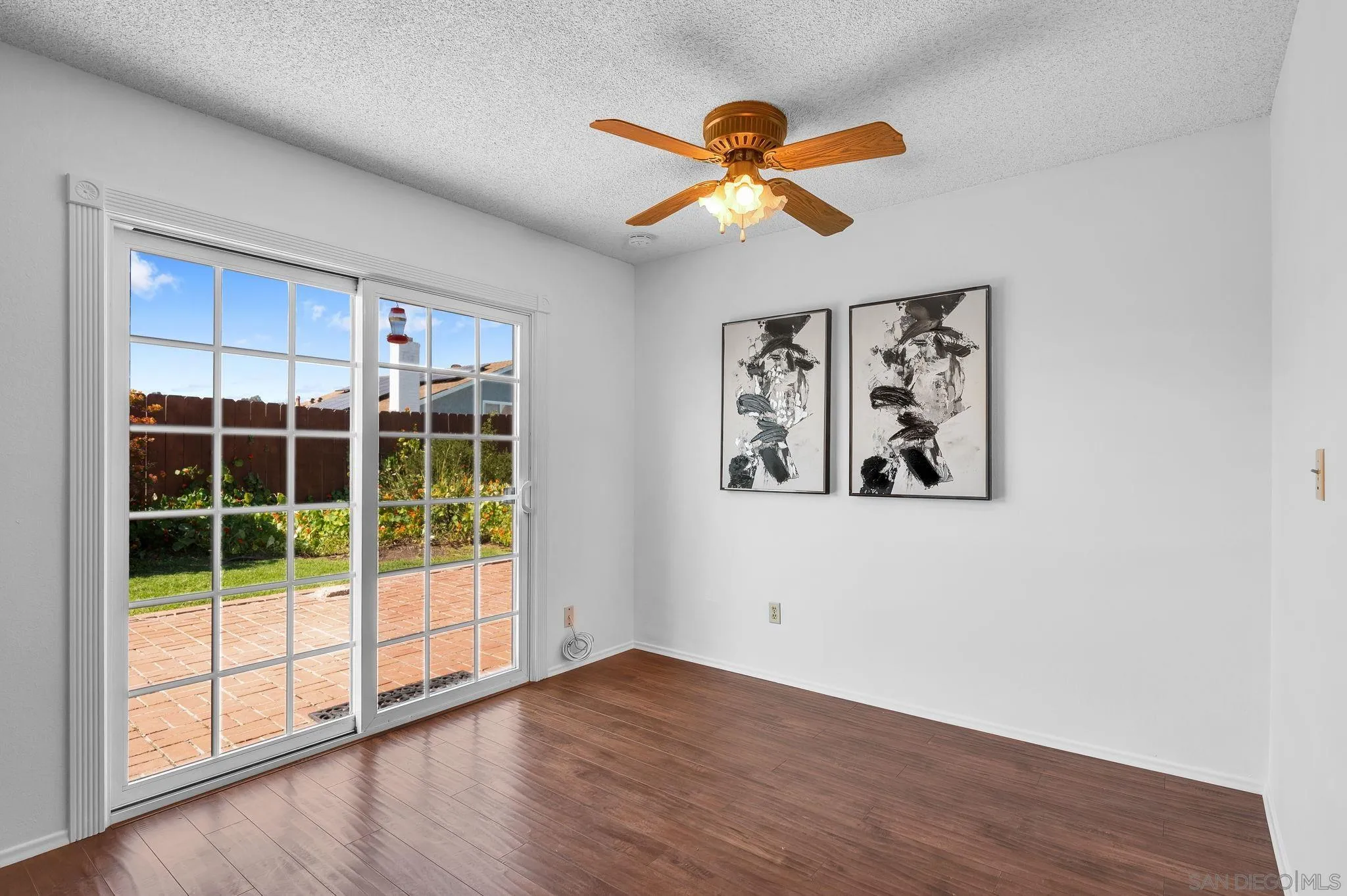10834 Buggywhip Drive Spring Valley, CA 91978 - Photo 5 of 36 a view of a big room with wooden floor and windows