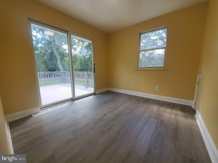 300 Ridge Road Browns Mills, NJ 08015 - Photo 11 of 28 a view of empty room with wooden floor and fan