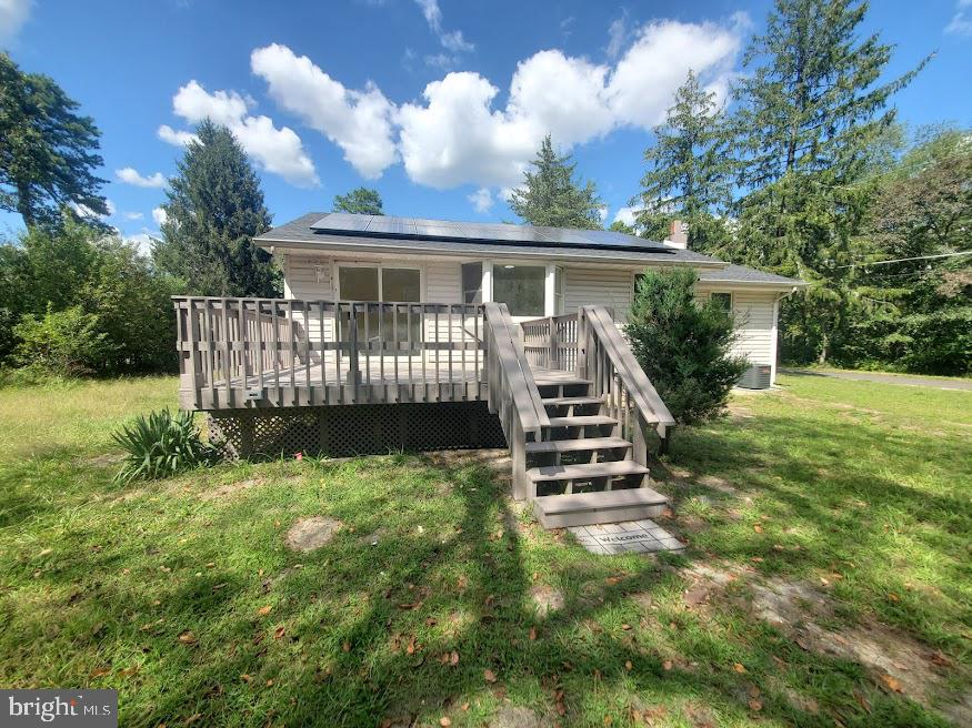 300 Ridge Road Browns Mills, NJ 08015 - Photo 25 of 28 a view of a house with backyard and a garden