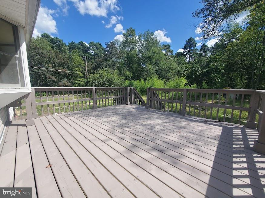 300 Ridge Road Browns Mills, NJ 08015 - Photo 27 of 28 a balcony with lots of trees in the background