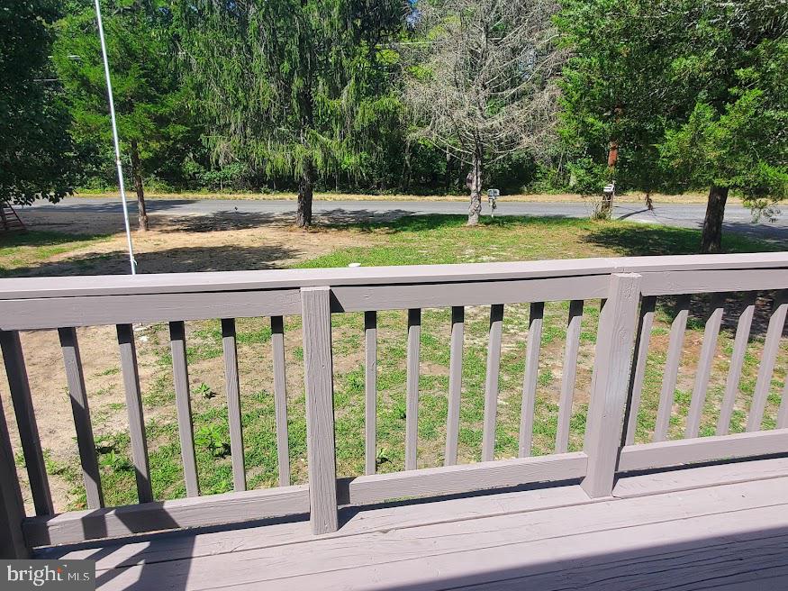 300 Ridge Road Browns Mills, NJ 08015 - Photo 28 of 28 a view of a wooden deck and a yard