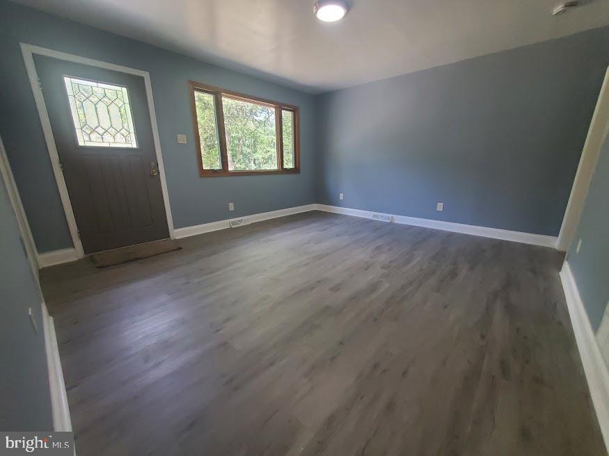 300 Ridge Road Browns Mills, NJ 08015 - Photo 5 of 28 an empty room with wooden floor and windows