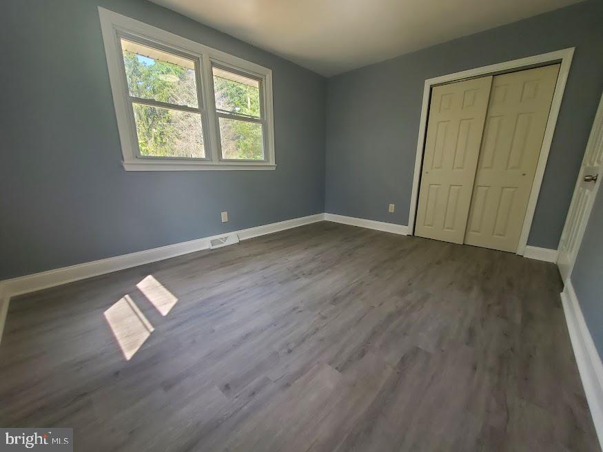 300 Ridge Road Browns Mills, NJ 08015 - Photo 8 of 28 a view of an empty room with wooden floor and a window