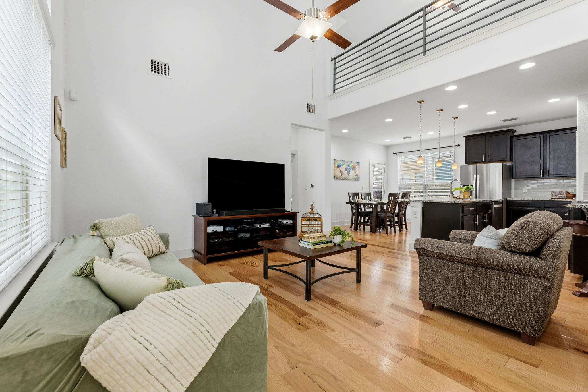 1007 Totis Road Austin, TX 78748 - Photo 6 of 37 a living room with furniture and a flat screen tv