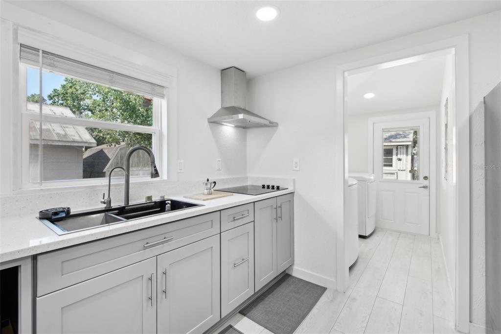 1626 Gar Street St. Cloud, FL 34771 - Photo 12 of 45 a kitchen with a sink and cabinets