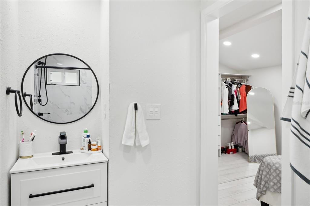 1626 Gar Street St. Cloud, FL 34771 - Photo 17 of 45 a bathroom with a sink and a mirror