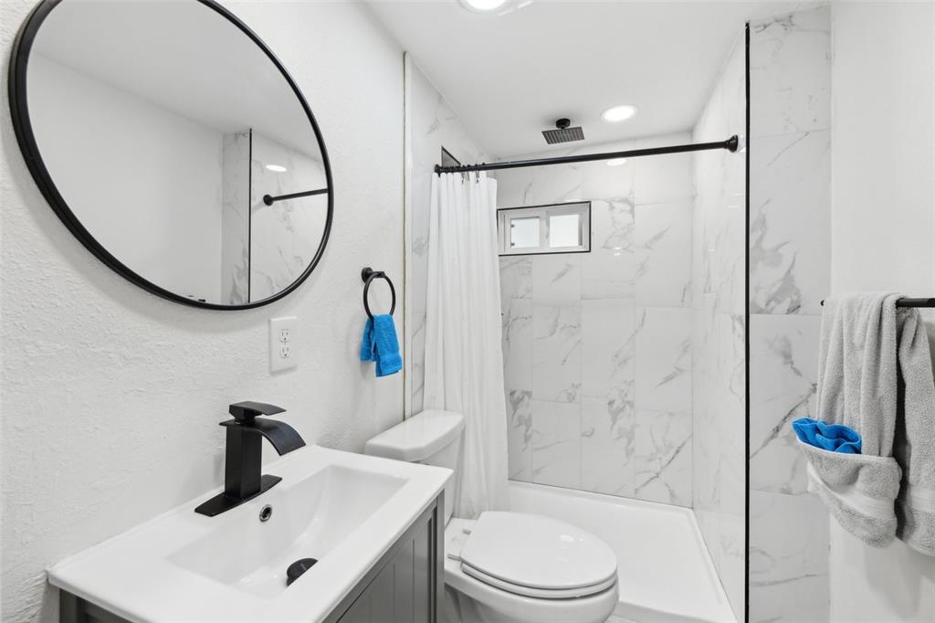 1626 Gar Street St. Cloud, FL 34771 - Photo 18 of 45 a bathroom with a sink toilet and shower