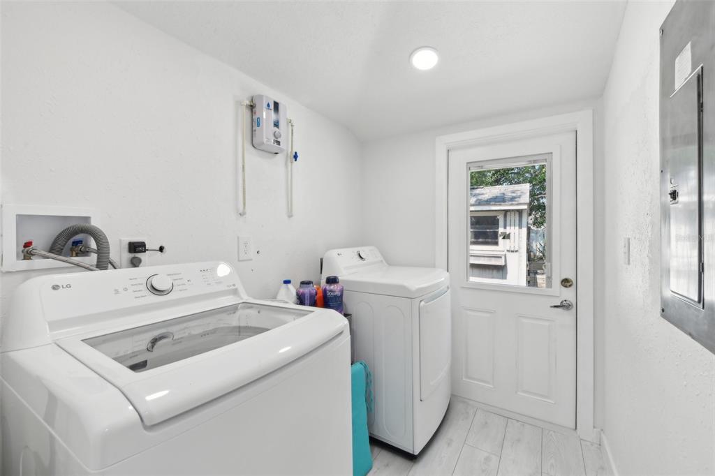 1626 Gar Street St. Cloud, FL 34771 - Photo 22 of 45 a utility room with dryer and washer