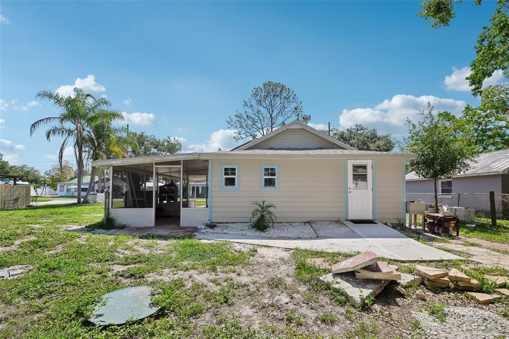 1626 Gar Street St. Cloud, FL 34771 - Photo 24 of 45 a front view of a house with garden