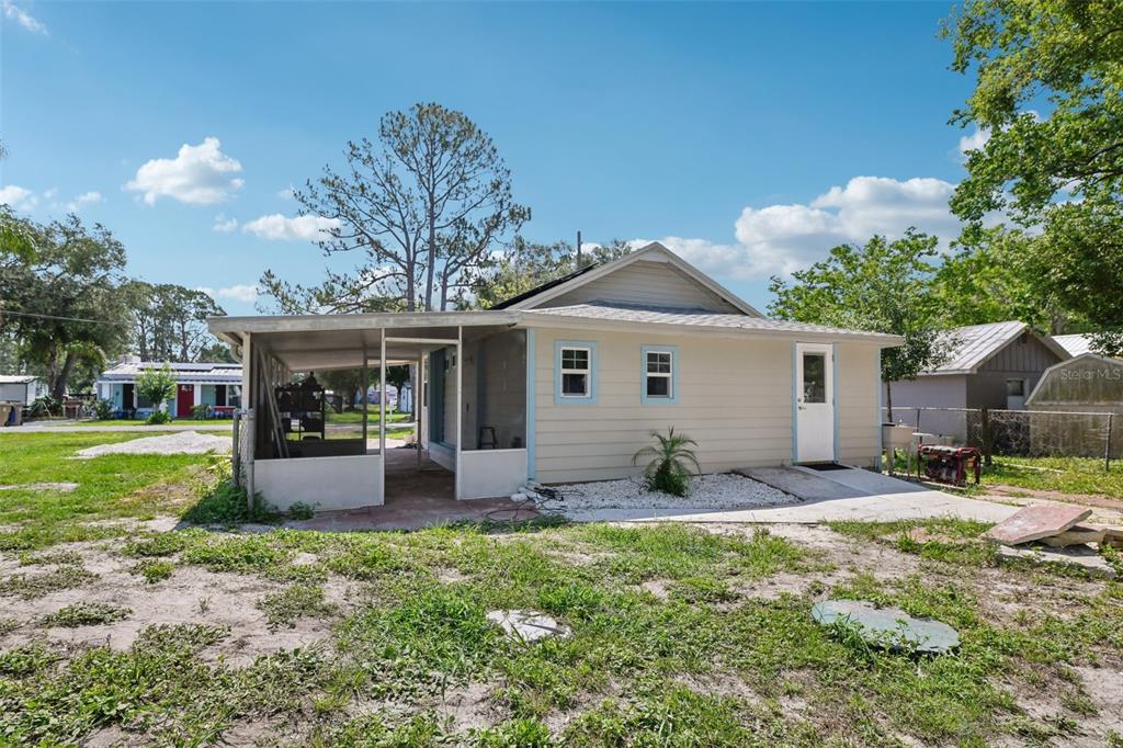1626 Gar Street St. Cloud, FL 34771 - Photo 25 of 45 a front view of a house with garden