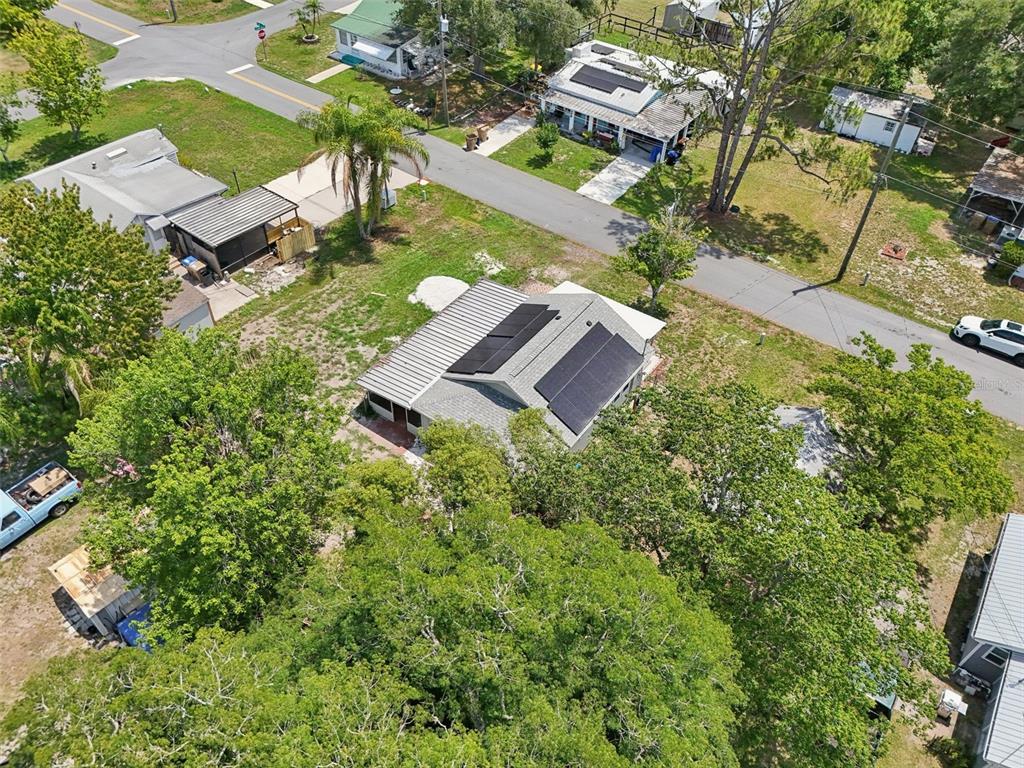 1626 Gar Street St. Cloud, FL 34771 - Photo 35 of 45 an aerial view of a house with yard and parking