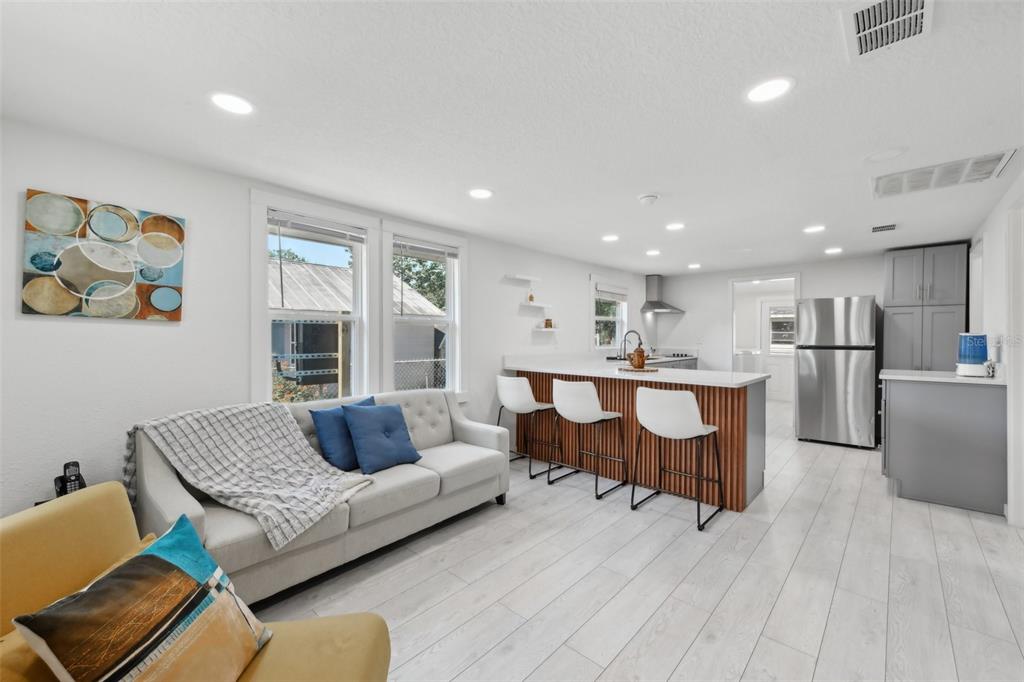 1626 Gar Street St. Cloud, FL 34771 - Photo 4 of 45 a living room with furniture and kitchen view