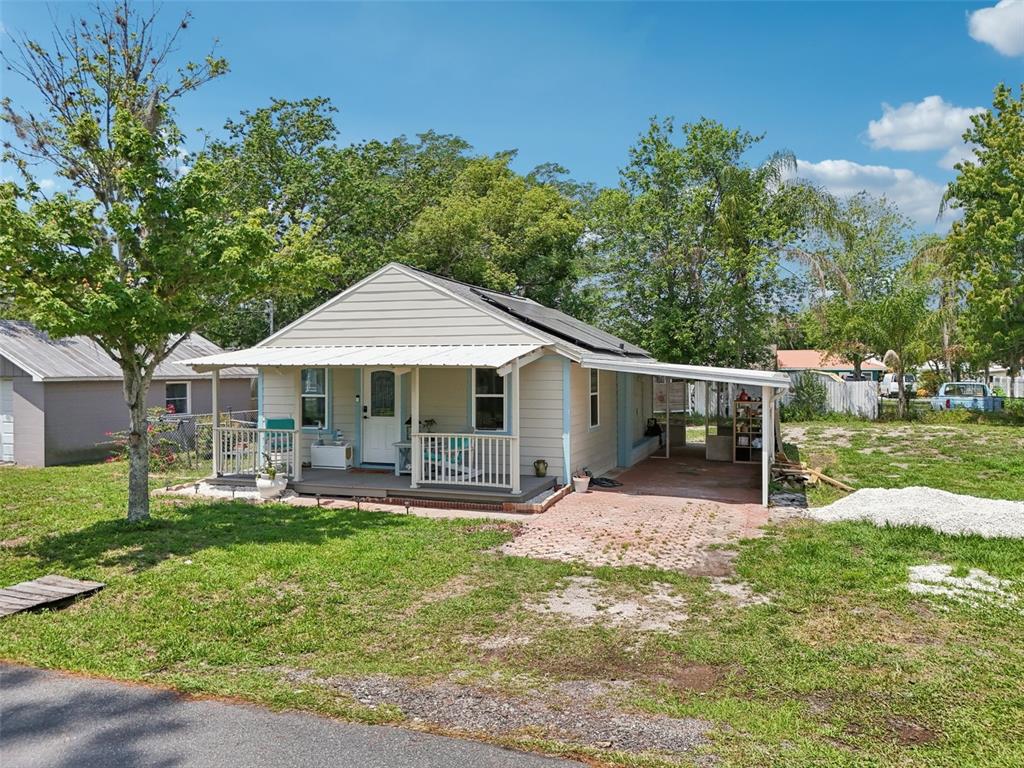 1626 Gar Street St. Cloud, FL 34771 - Photo 45 of 45 a front view of a house with garden