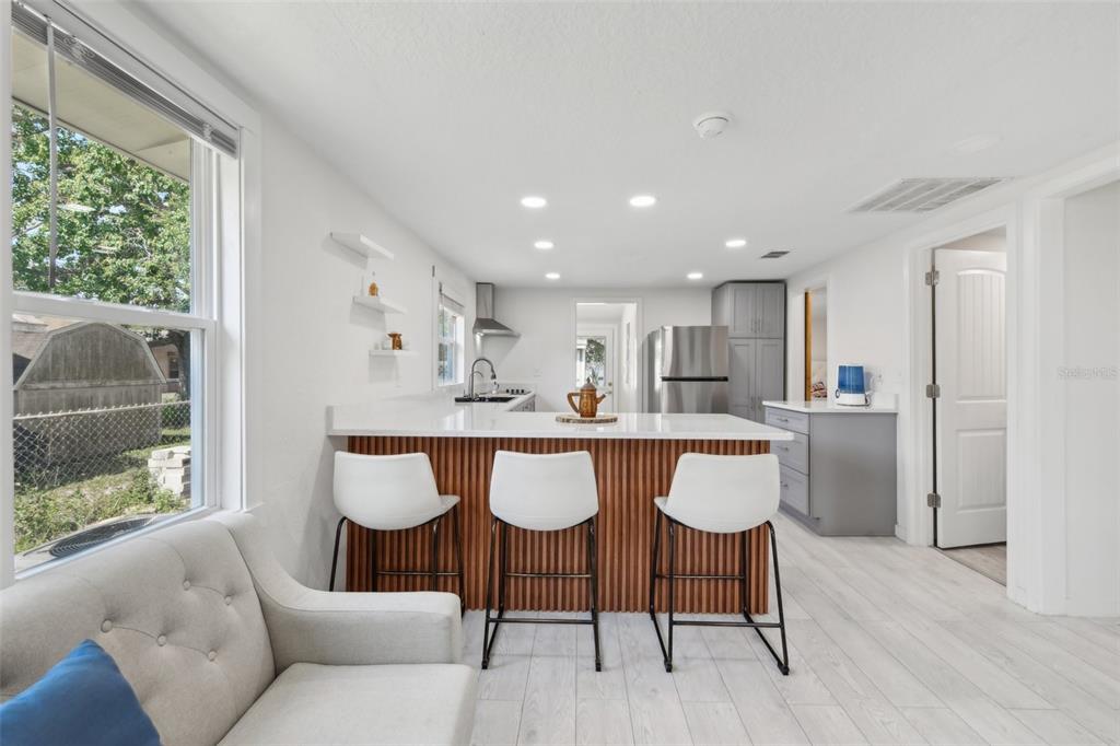 1626 Gar Street St. Cloud, FL 34771 - Photo 5 of 45 a view of a dining room with furniture and wooden floor