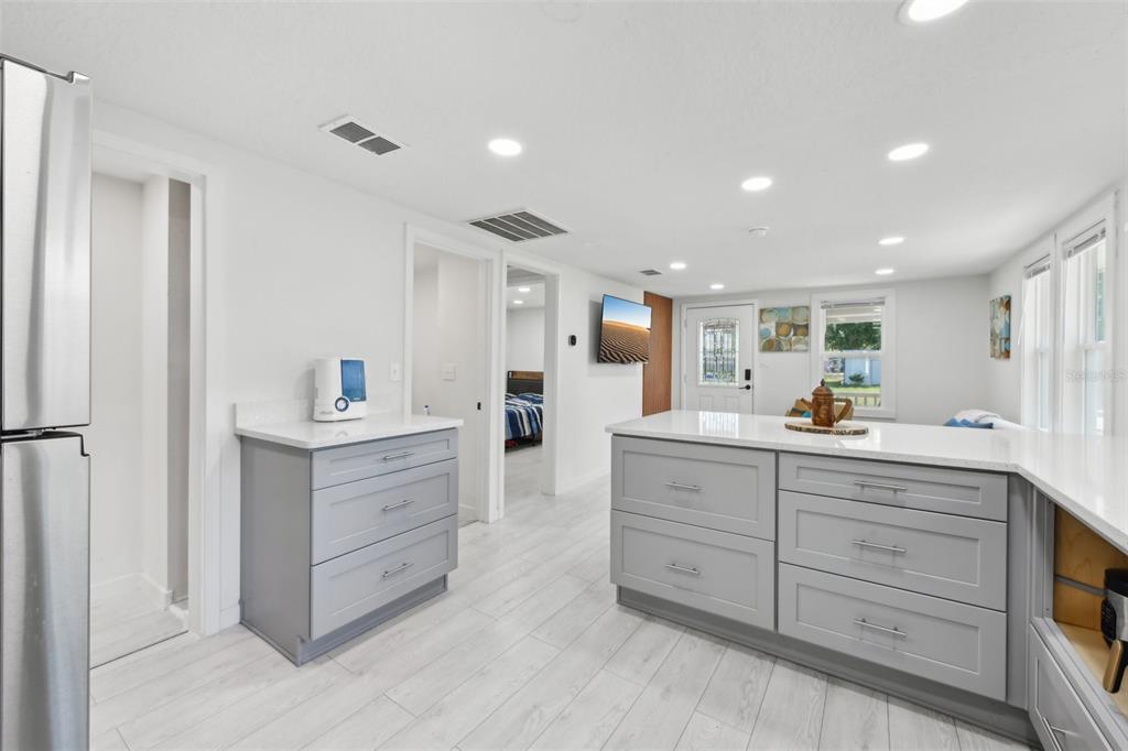 1626 Gar Street St. Cloud, FL 34771 - Photo 10 of 45 a kitchen with white cabinets and sink