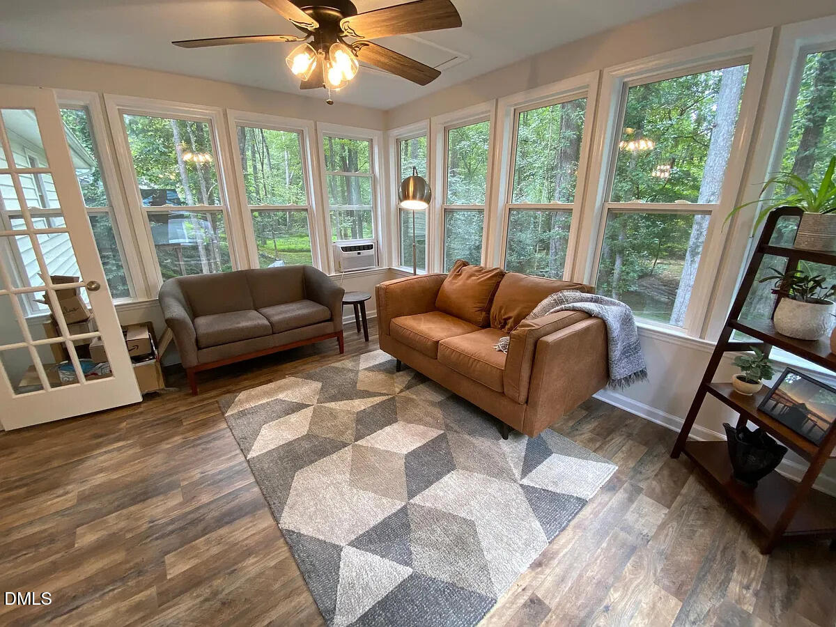 7501 Post Oak Road Raleigh, NC 27615 - Photo 16 of 40 a living room with furniture and a large window