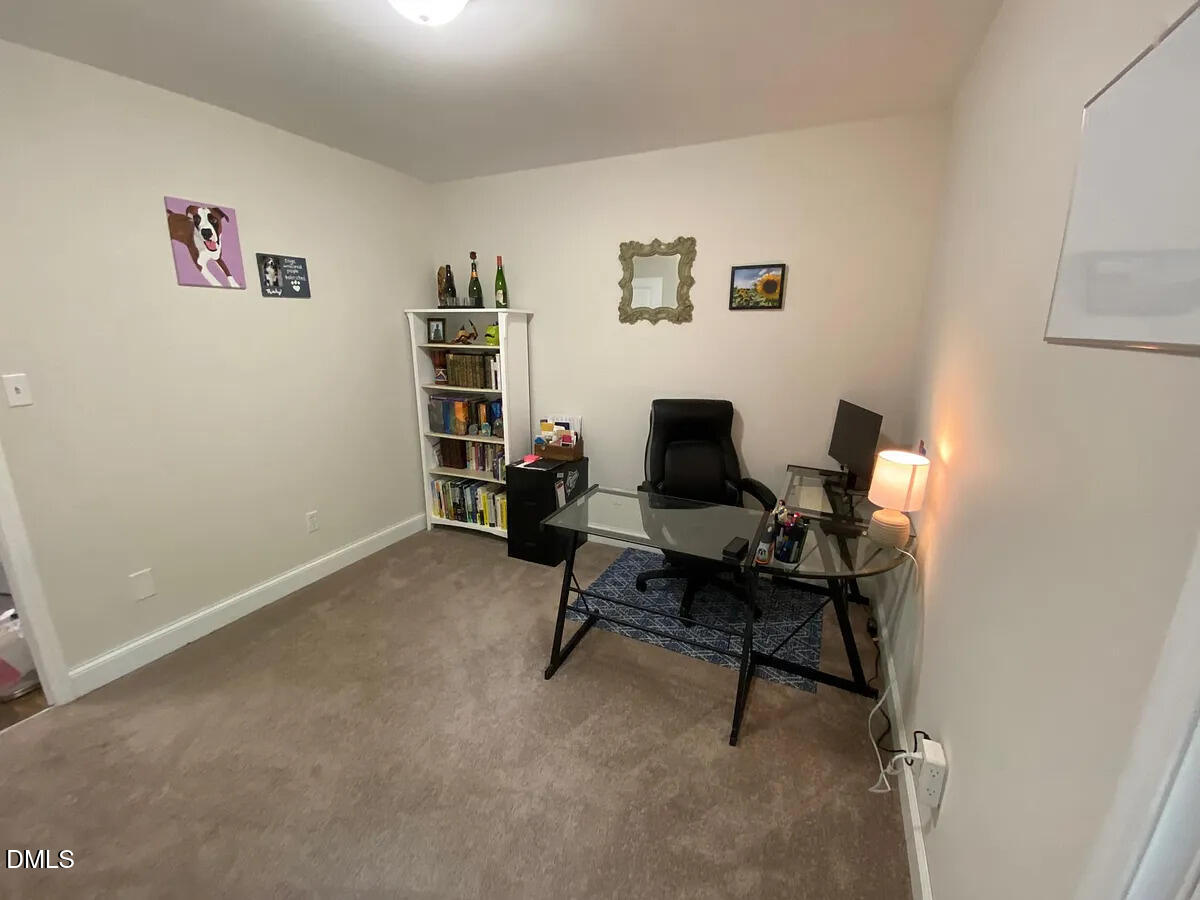 7501 Post Oak Road Raleigh, NC 27615 - Photo 17 of 40 a view of a workspace with furniture and a window
